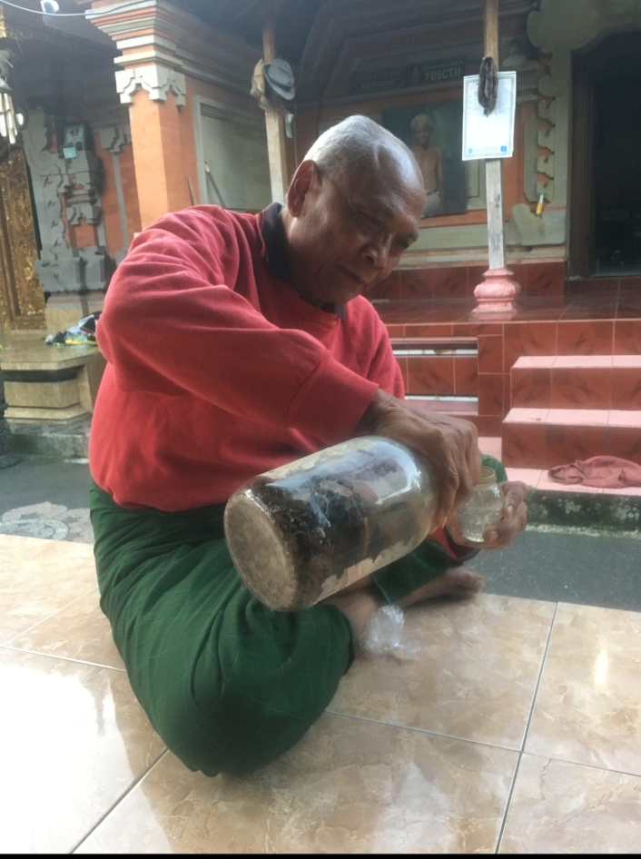 Wayan's father, Ketut, pouring us a glass of Arak (traditional balinese liquor) he's been fermenting for 30 years